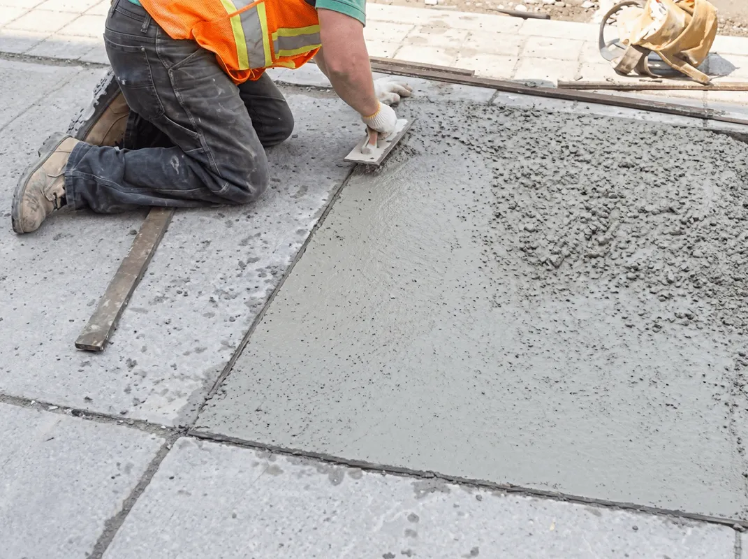 Professional repairing a concrete floor in Bellevue, WA